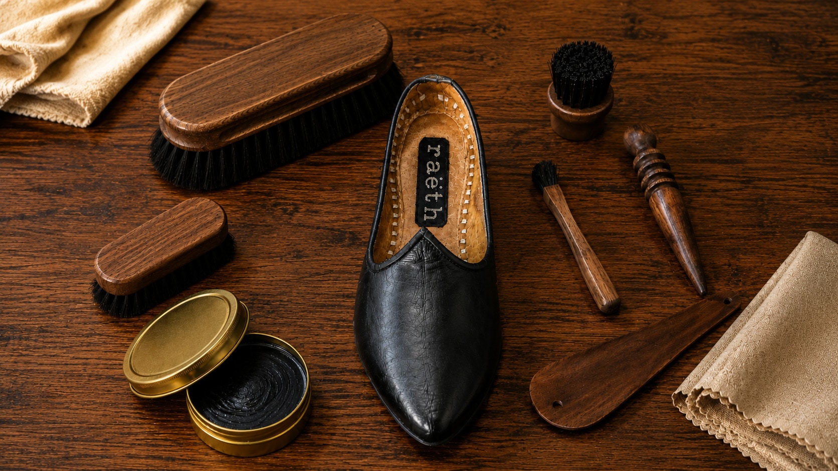 A leather jutti with brushes and care cream