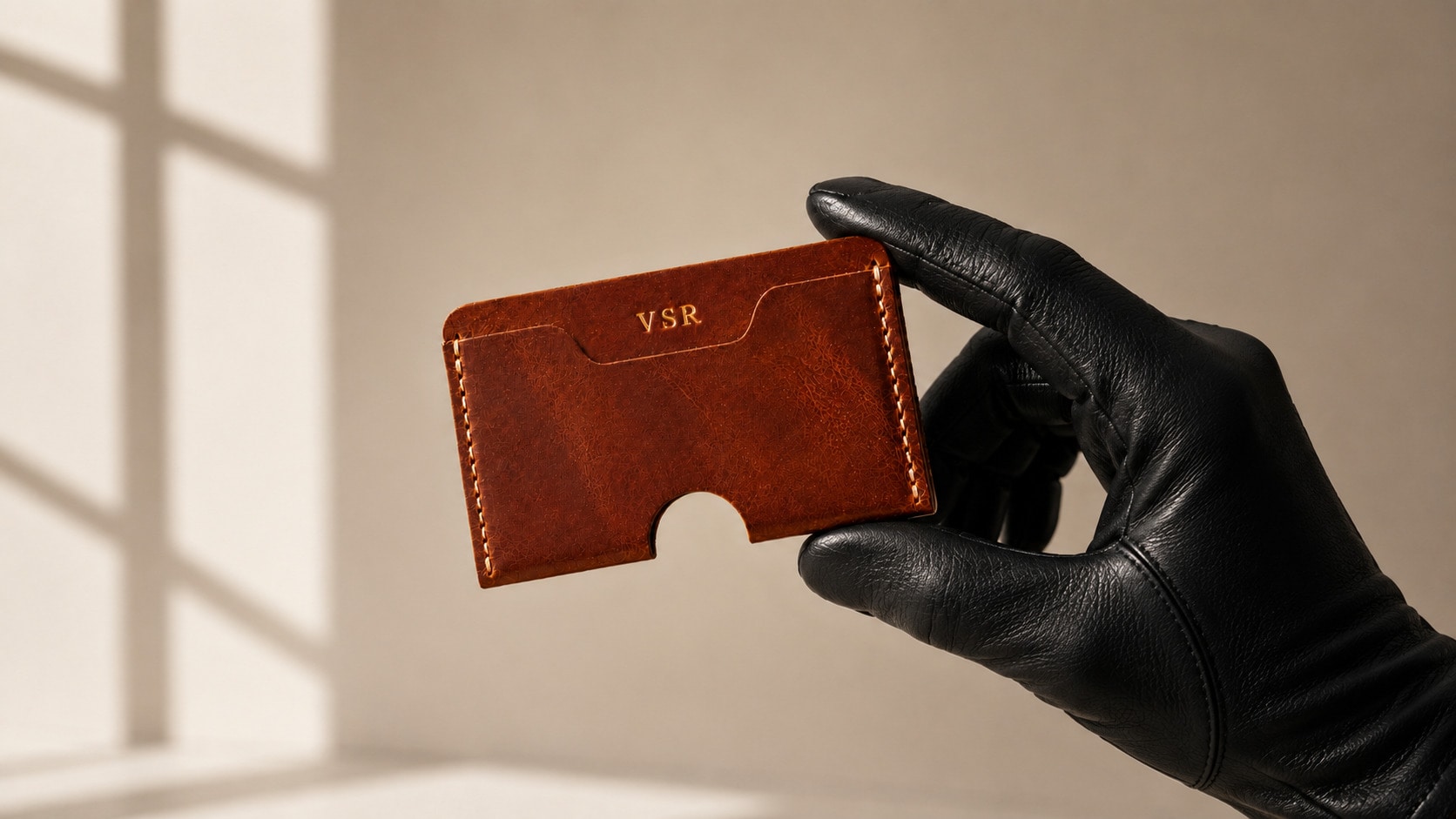 Initials embossed on a leather card holder